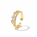 Gold ring with diamond accents on a white background