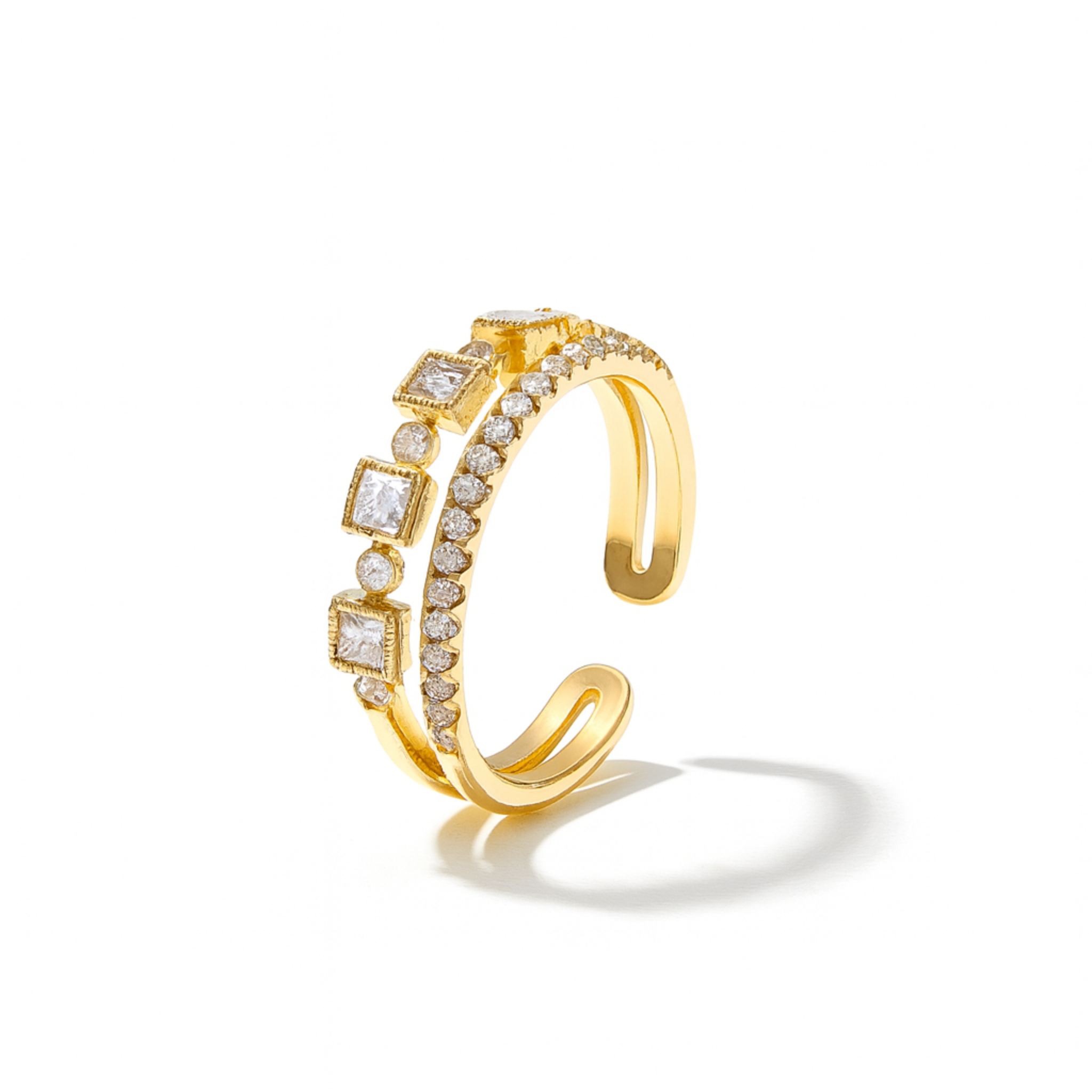 Gold ring with diamond accents on a white background