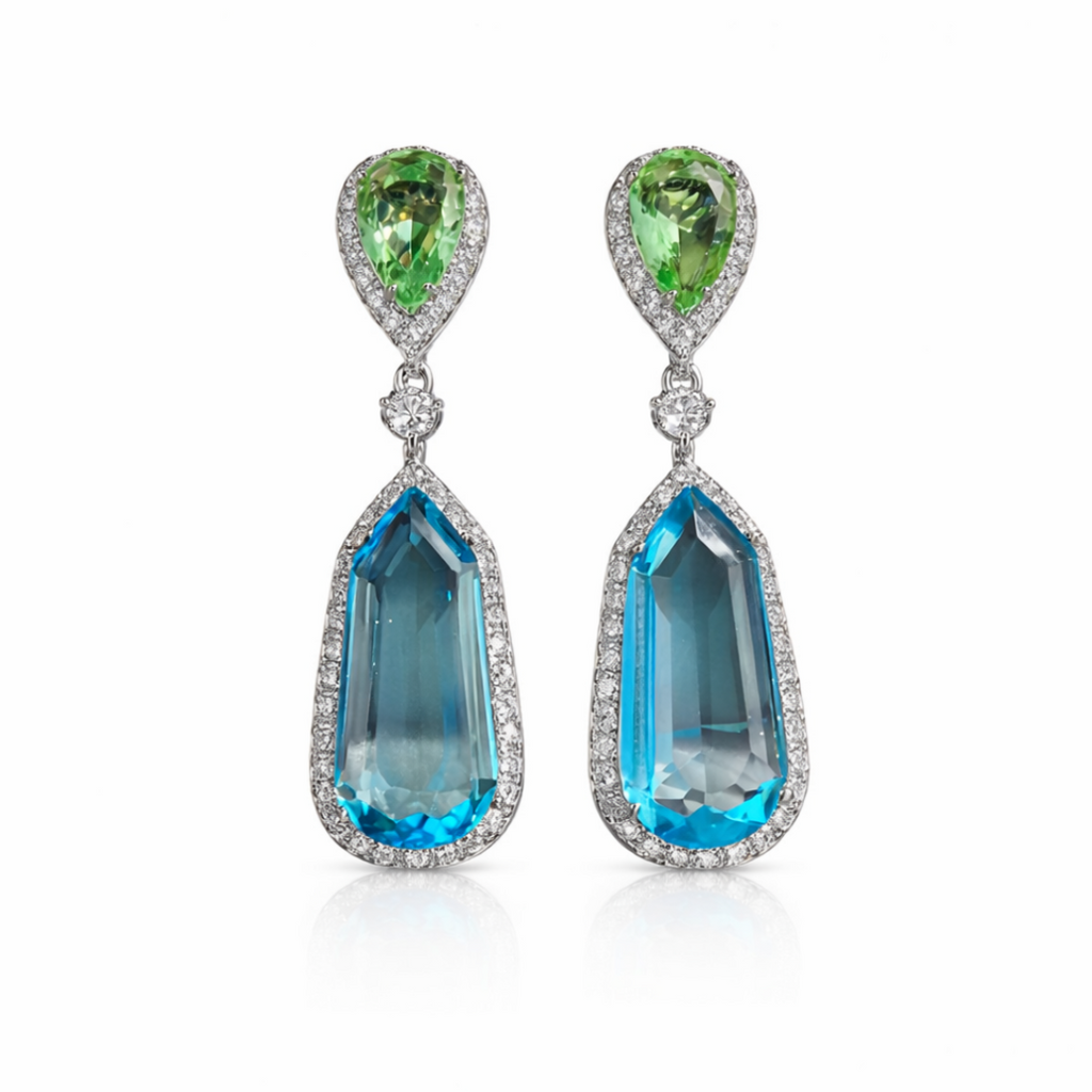 Pair of earrings with teardrop-shaped gemstones on a white background