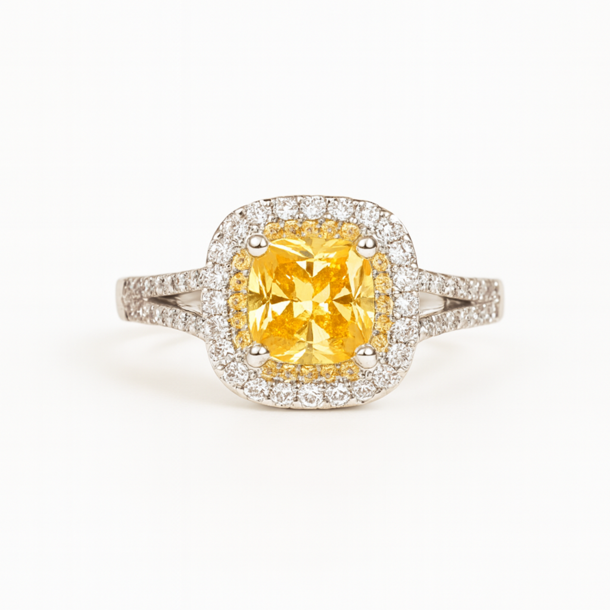 Ring with a yellow gemstone and diamond-studded band on a white background